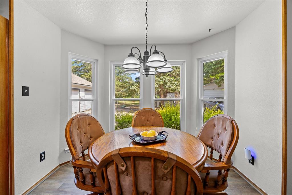 881 Wild Road Van Alstyne, TX 75495 - Photo 16 of 40 a view of a dining room with furniture window and outside view