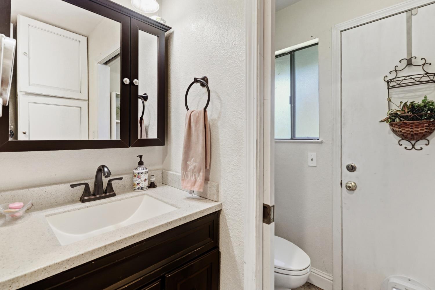 4330 Cavitt Stallman Road Granite Bay, CA 95746 - Photo 33 of 85 a bathroom with a sink a toilet and shower