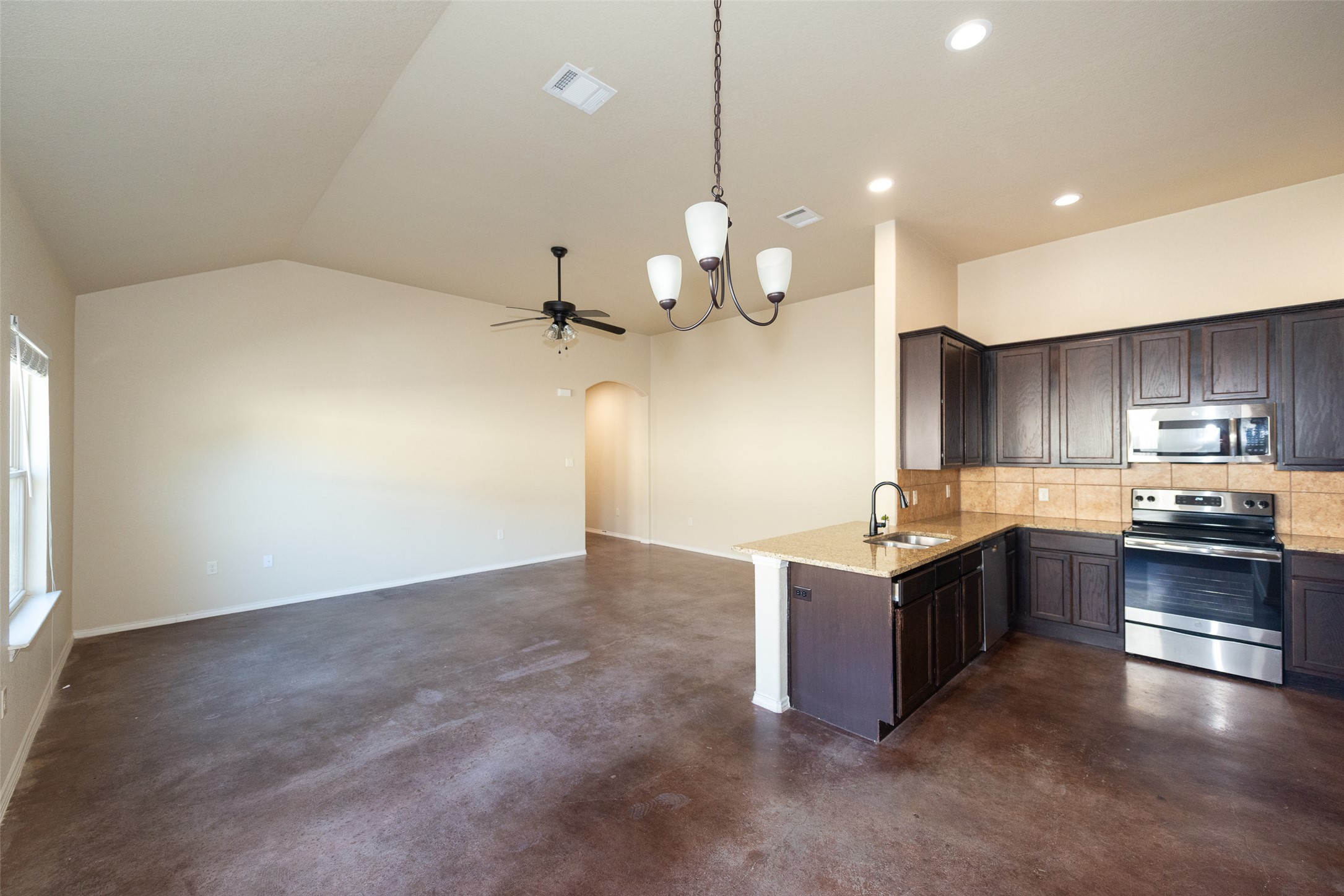 245 Joanne Loop, Unit B Buda, TX 78610 - Photo 9 of 33 View from dining area corner looking back towards kitchen and living area