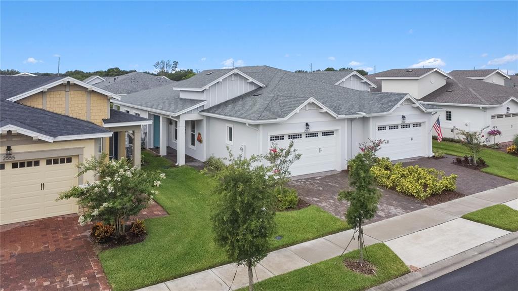 2557 Yellow Brick Road St. Cloud, FL 34772 - Photo 39 of 41 a front view of a house with garden