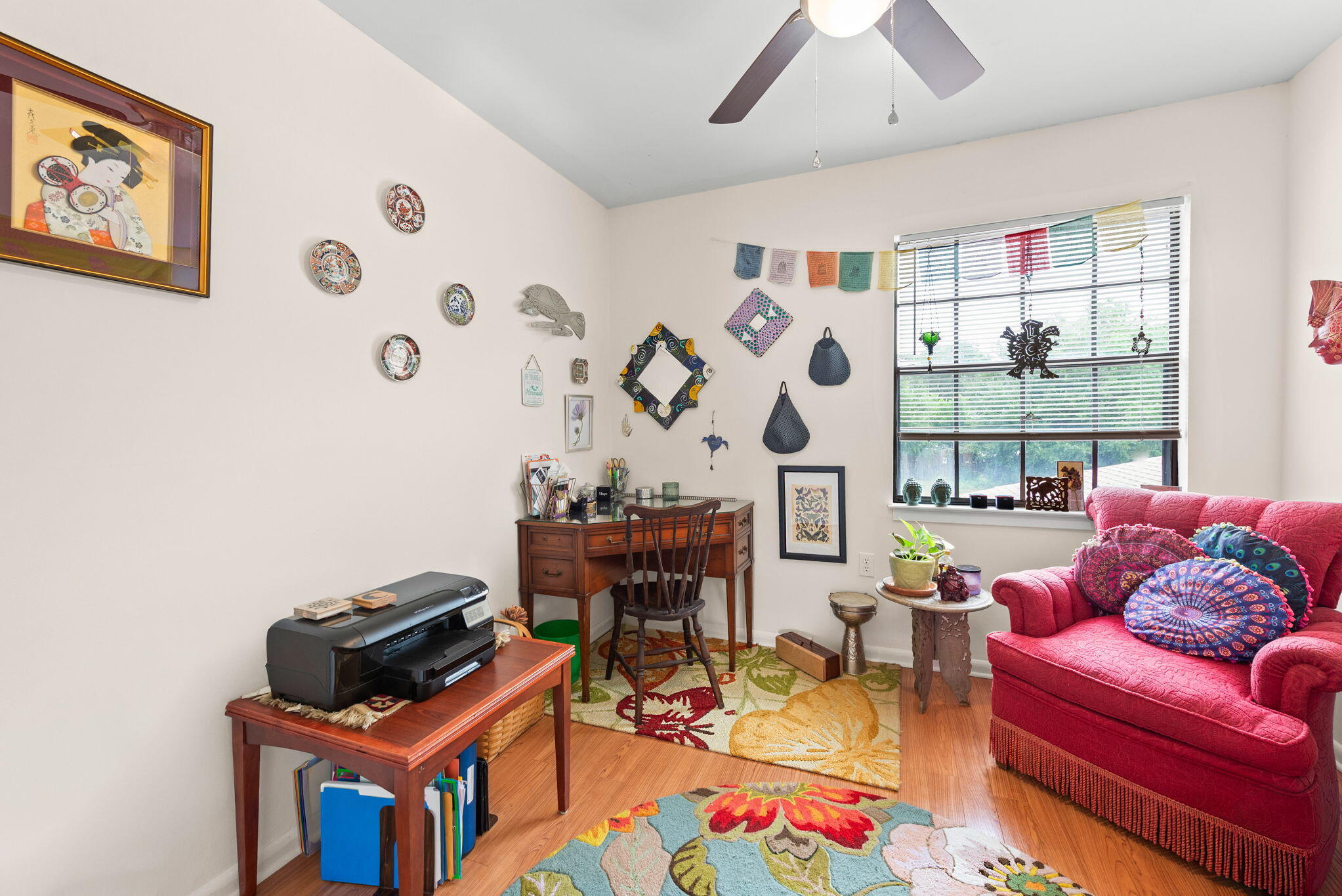 37 12th Street, Unit V126 Shalimar, FL 32579 - Photo 11 of 26 a living room with furniture a rug and a wall painting