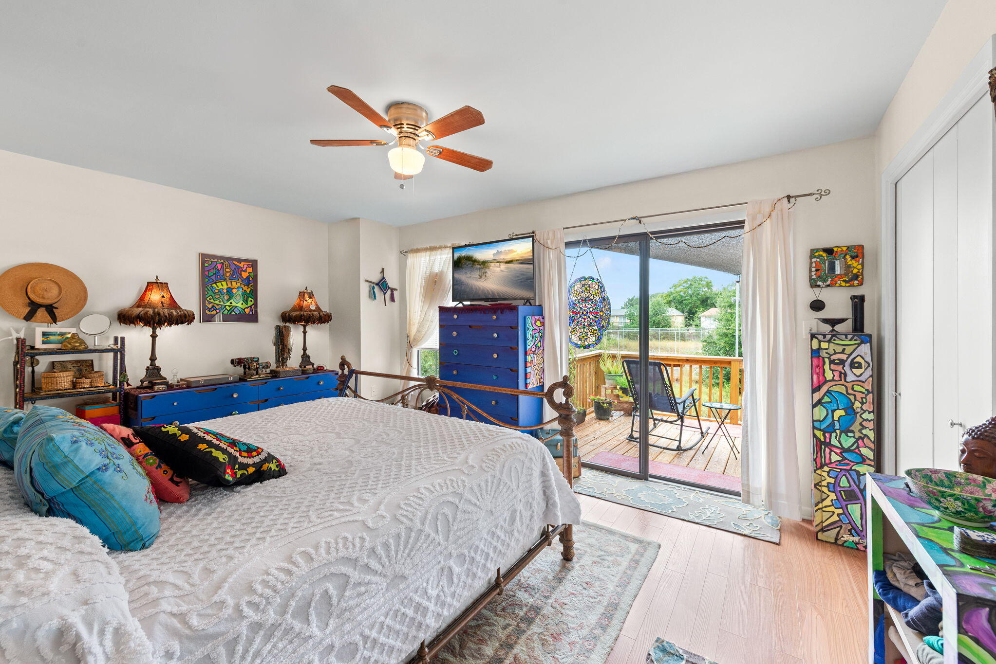 37 12th Street, Unit V126 Shalimar, FL 32579 - Photo 14 of 26 a bedroom with a large bed and a chandelier