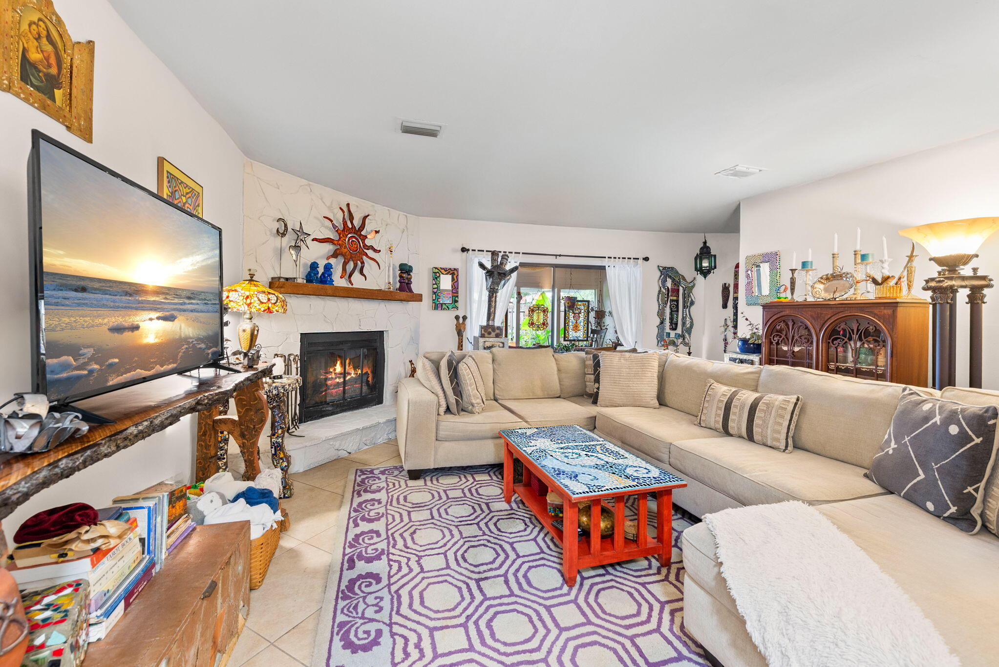 37 12th Street, Unit V126 Shalimar, FL 32579 - Photo 2 of 26 a living room with furniture flat screen tv and a fireplace