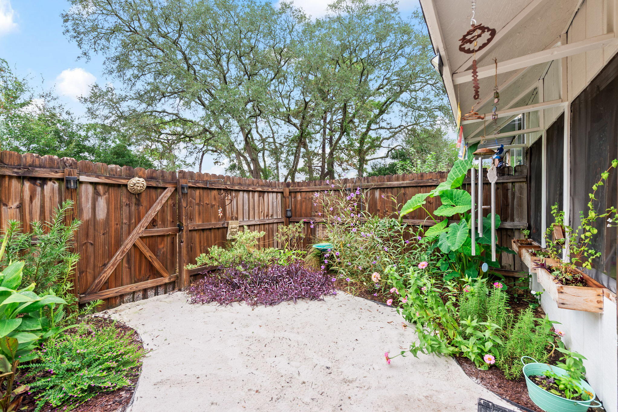37 12th Street, Unit V126 Shalimar, FL 32579 - Photo 21 of 26 a backyard of a house with lots of green space
