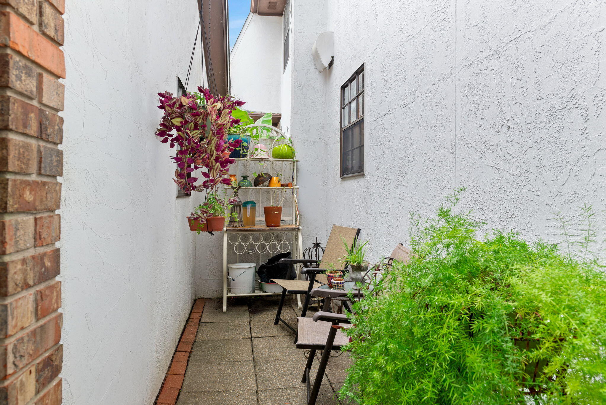 37 12th Street, Unit V126 Shalimar, FL 32579 - Photo 25 of 26 a view of balcony with chair and flowers
