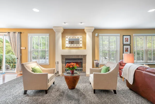 a kitchen with granite countertop a sink stove and refrigerator