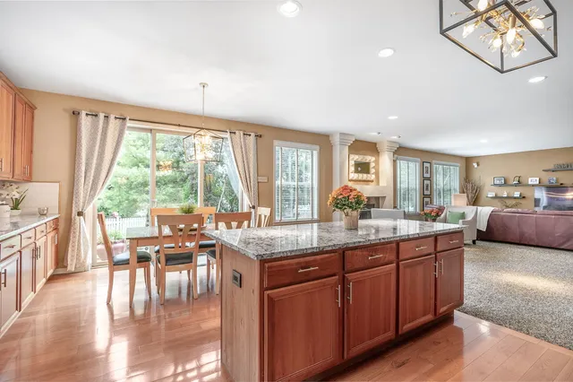 a kitchen with counter top space and windows
