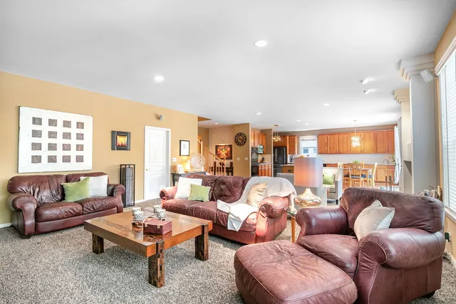 a living room with furniture and a table