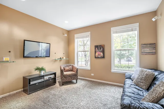 a view of livingroom with furniture and windows