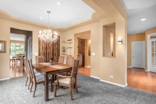 a view of a hallway with a livingroom with furniture