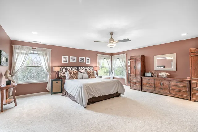 a large white kitchen with a large window