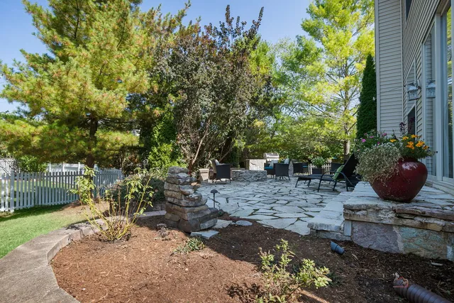 a view of a backyard with sitting area