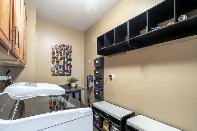 a view of a patio with couches table and chairs and potted plants