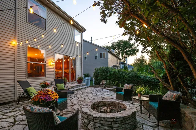 a view of a house with backyard sitting area