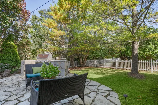 a picture of a room with a white wall and a large window