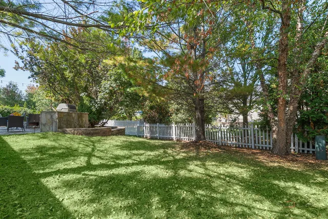 a living room with furniture and large windows