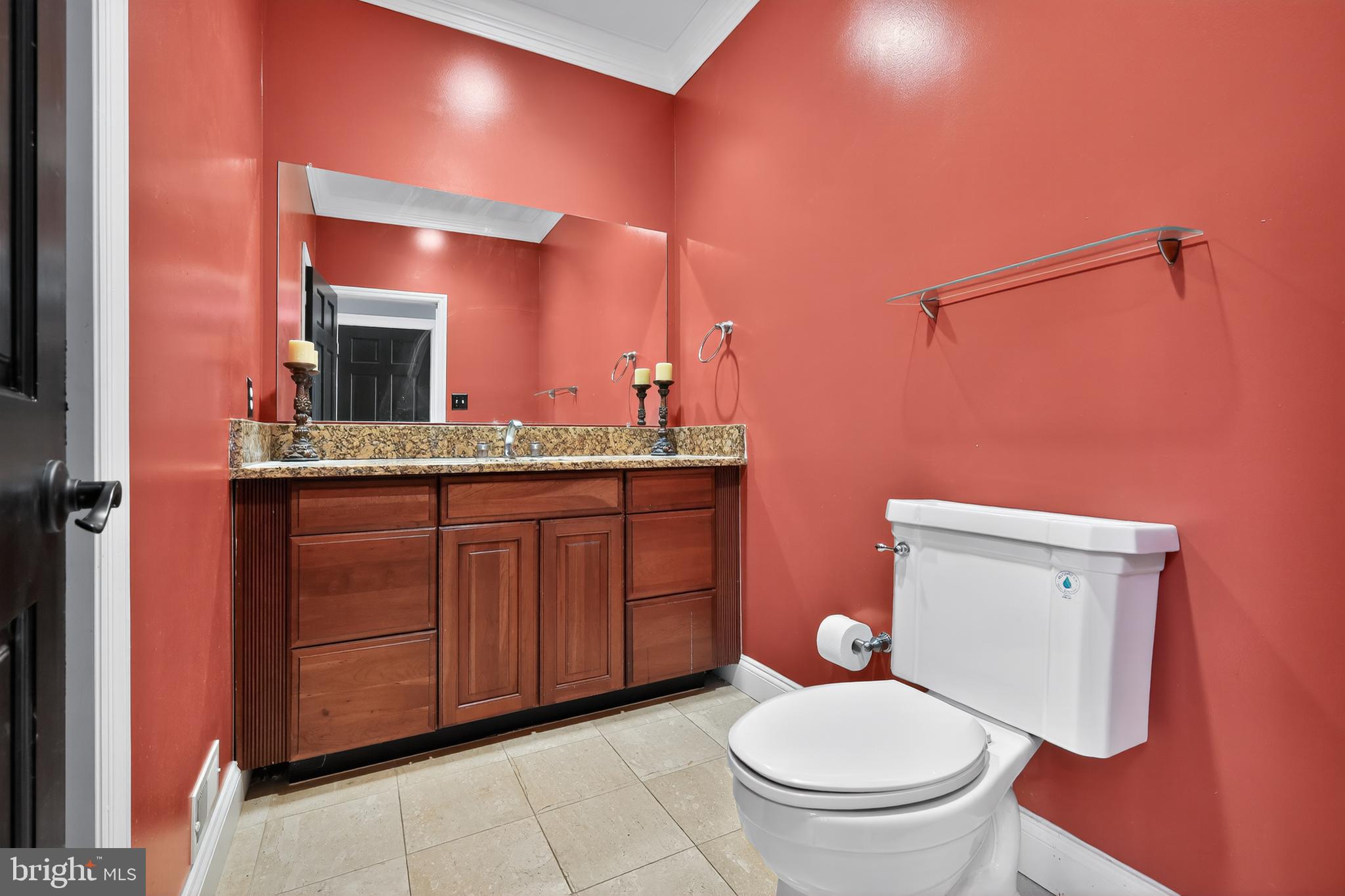 7328 Rocky Road Gaithersburg, MD 20882 - Photo 26 of 33 a bathroom with a granite countertop toilet sink and mirror