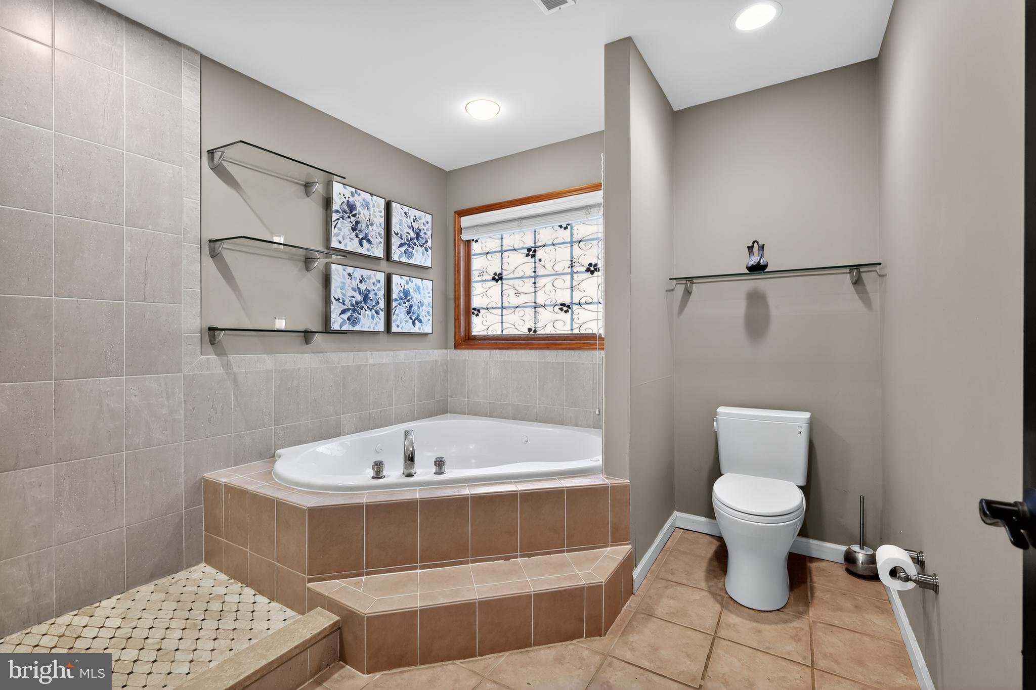 7328 Rocky Road Gaithersburg, MD 20882 - Photo 29 of 33 a bathroom with a bathtub and a toilet