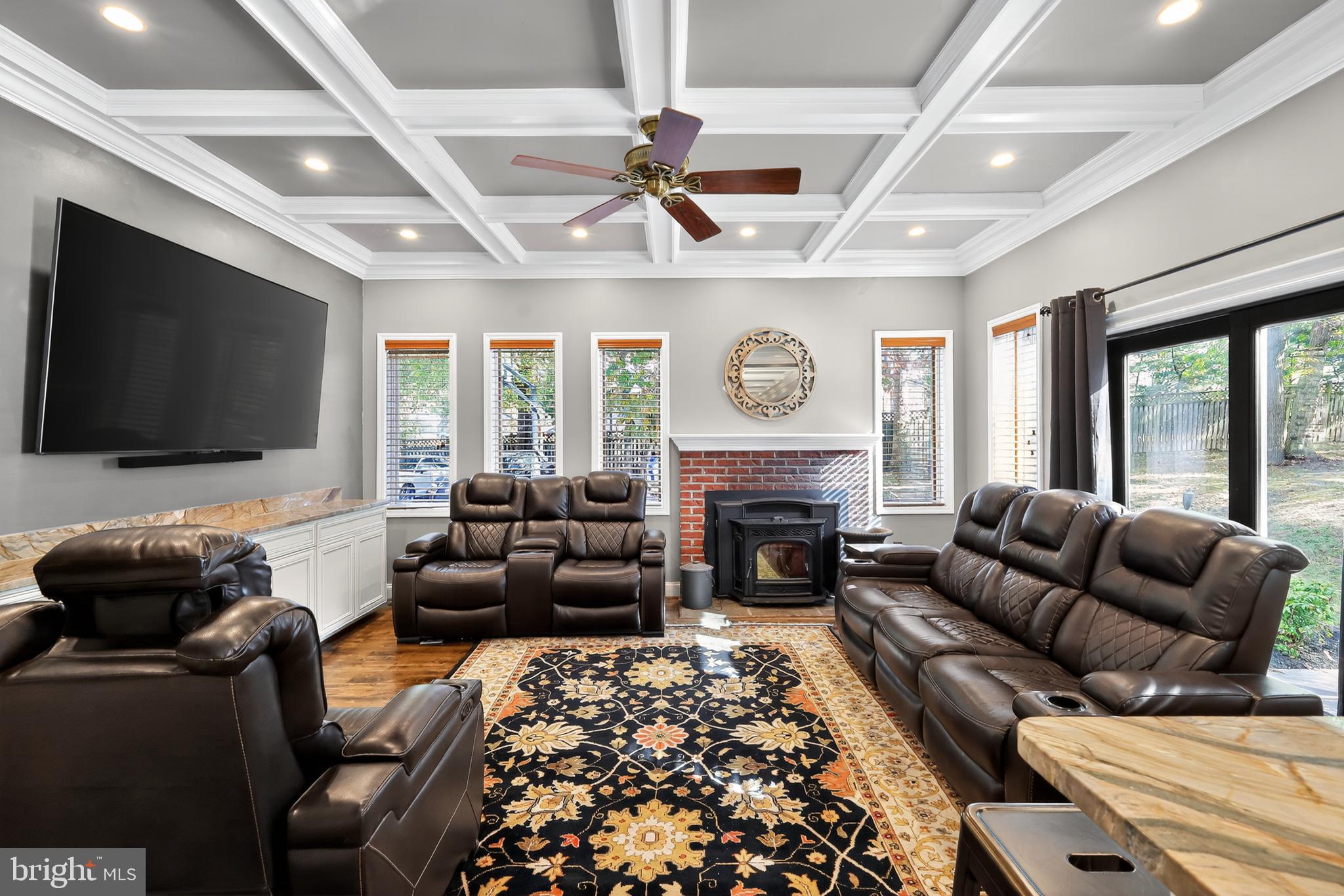 7328 Rocky Road Gaithersburg, MD 20882 - Photo 9 of 33 a living room with furniture a flat screen tv and a fireplace