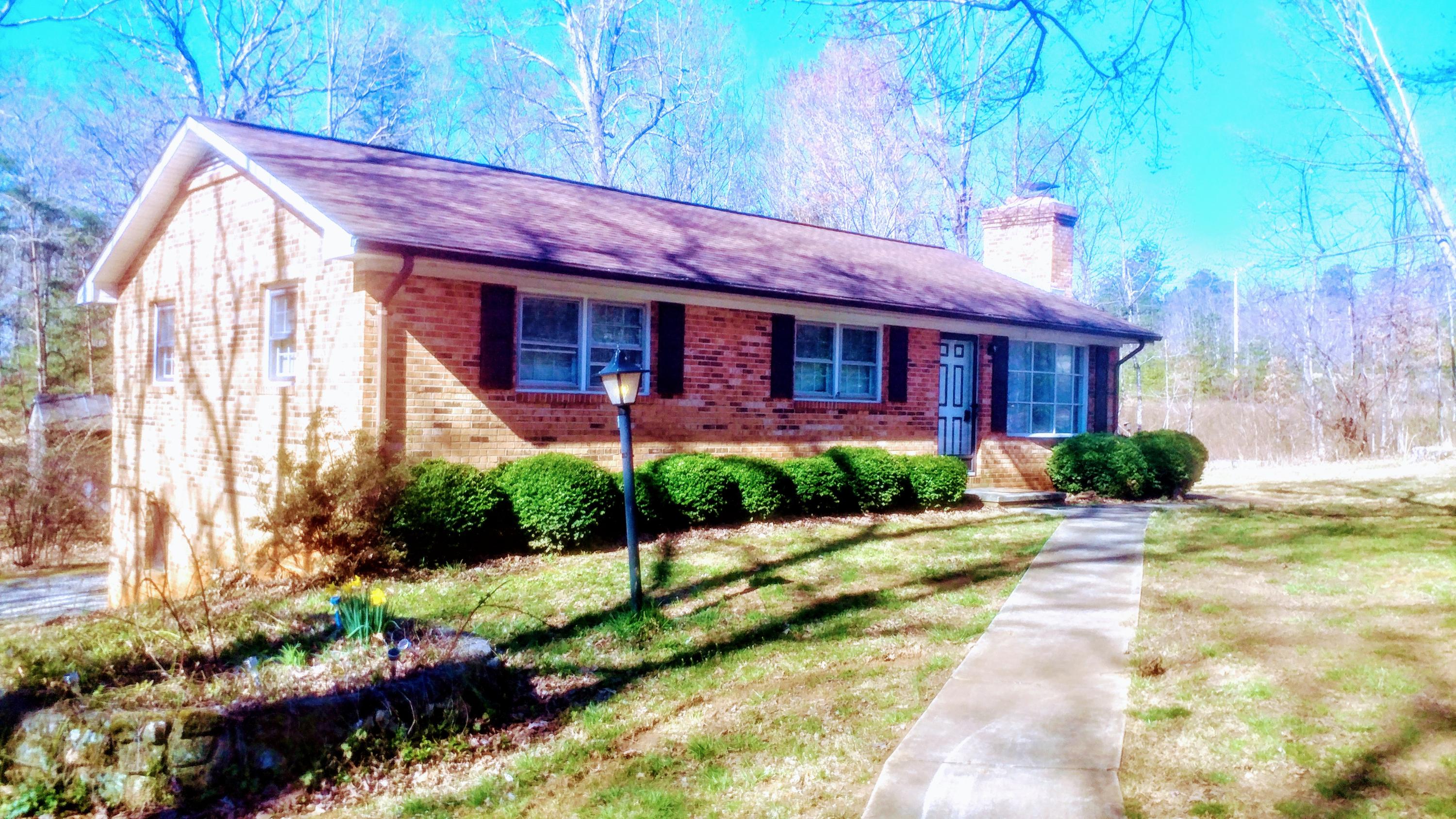 2917 Edwardsville Road Hardy, VA 24101 - Photo 1 of 1 a front view of a house with a yard and potted plants