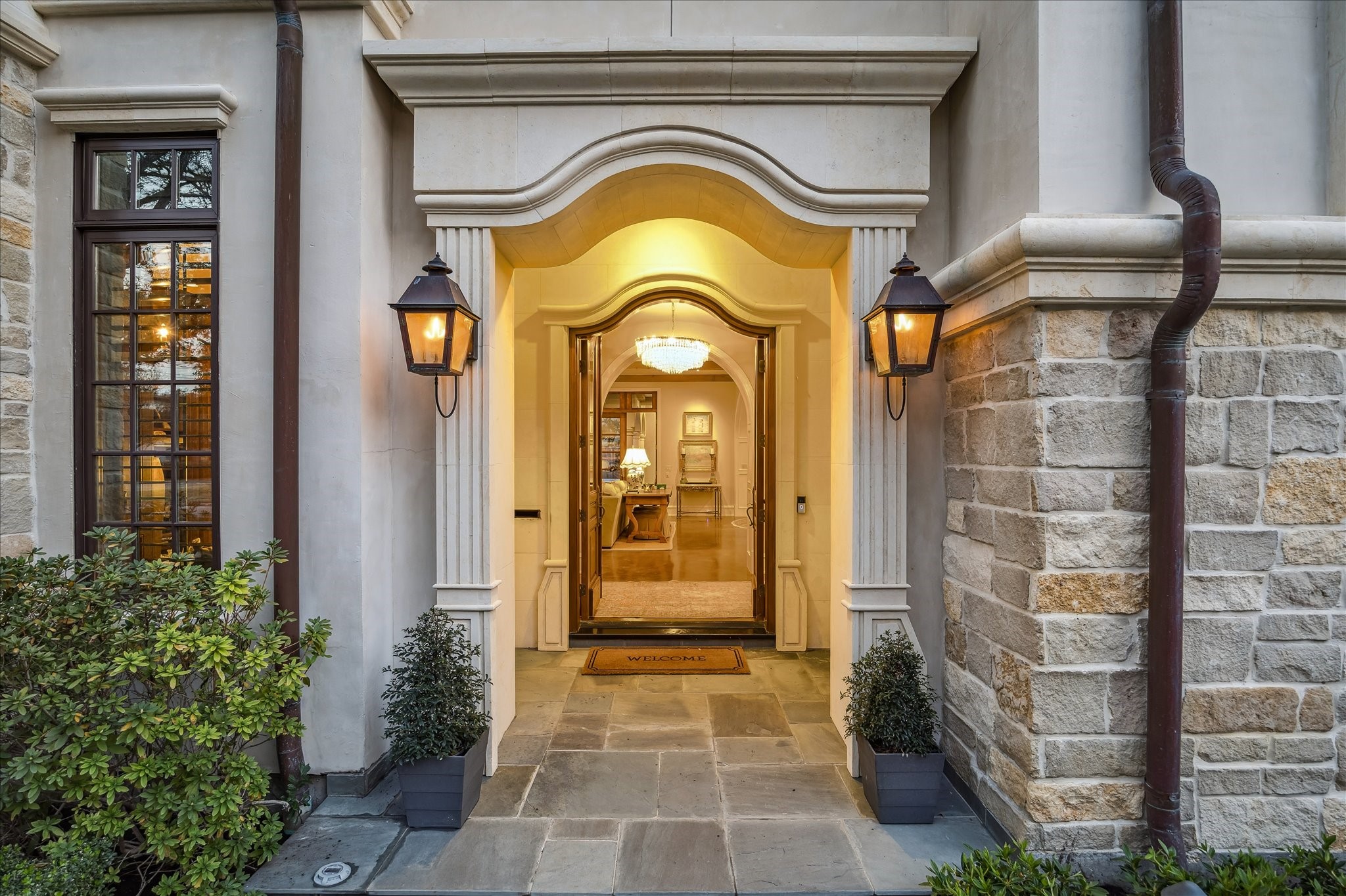 3109 Locke Lane Houston, TX 77019 - Photo 3 of 50 The covered front entry welcomes you with elegant architectural details, ambient lighting, and a sense of timeless sophistication. It perfectly sets the tone for the luxurious interiors that lie beyond the doors.