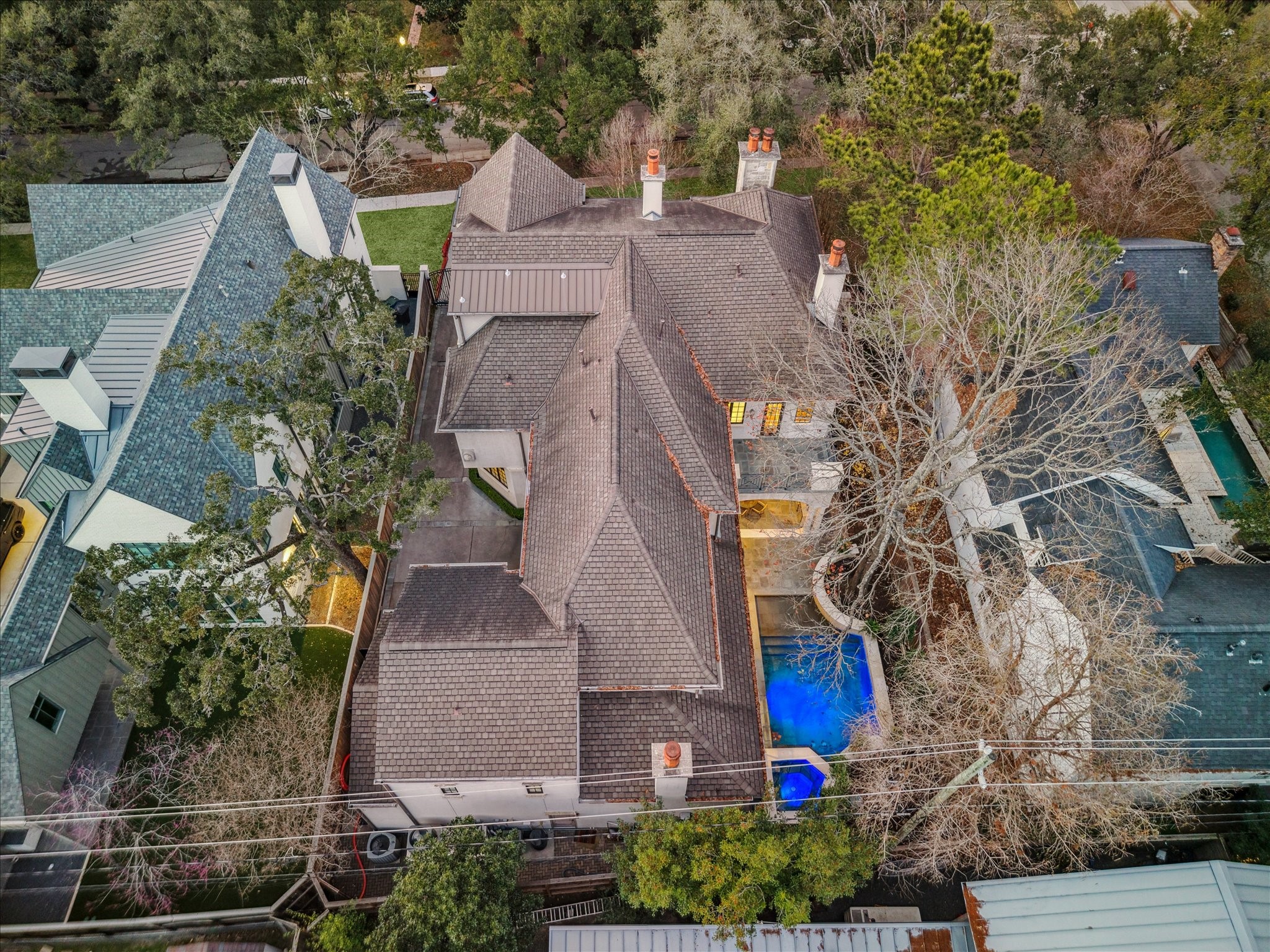 3109 Locke Lane Houston, TX 77019 - Photo 47 of 50 Aerial view of this exceptional Morris Hullinger-built residence, set on a 10,275’ lot with 6,885’ of living space. Featuring 5 bedrooms, 6 full baths, and 2 half baths, this 2008 home combines expansive scale with thoughtful design and timeless appeal.