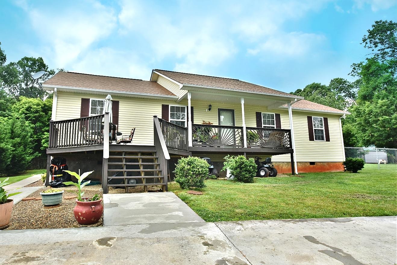 950 Chestnut Grove Road Dandridge, TN 37725 - Photo 1 of 25 a front view of a house with porch