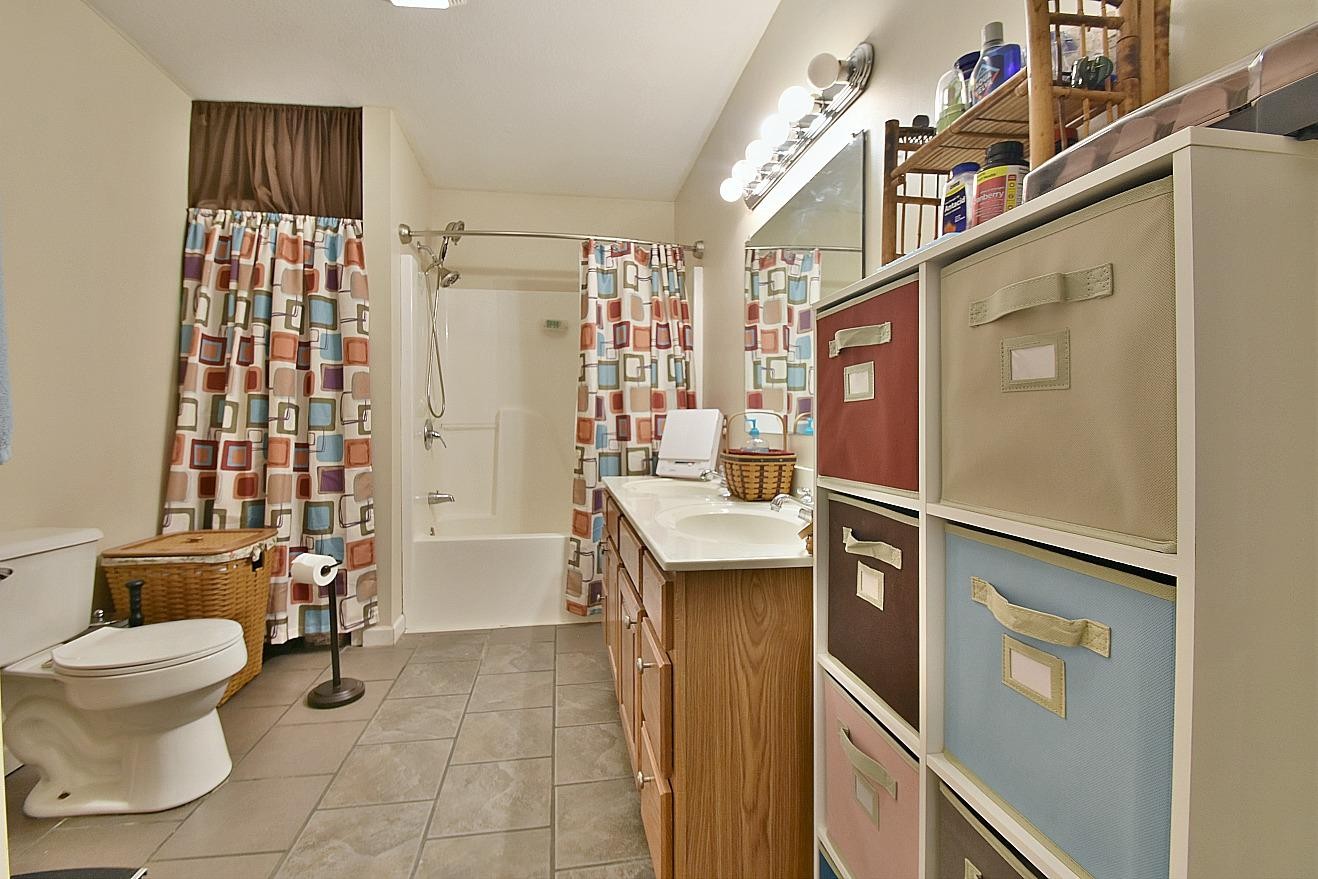 950 Chestnut Grove Road Dandridge, TN 37725 - Photo 15 of 25 a bathroom with a sink toilet and shower