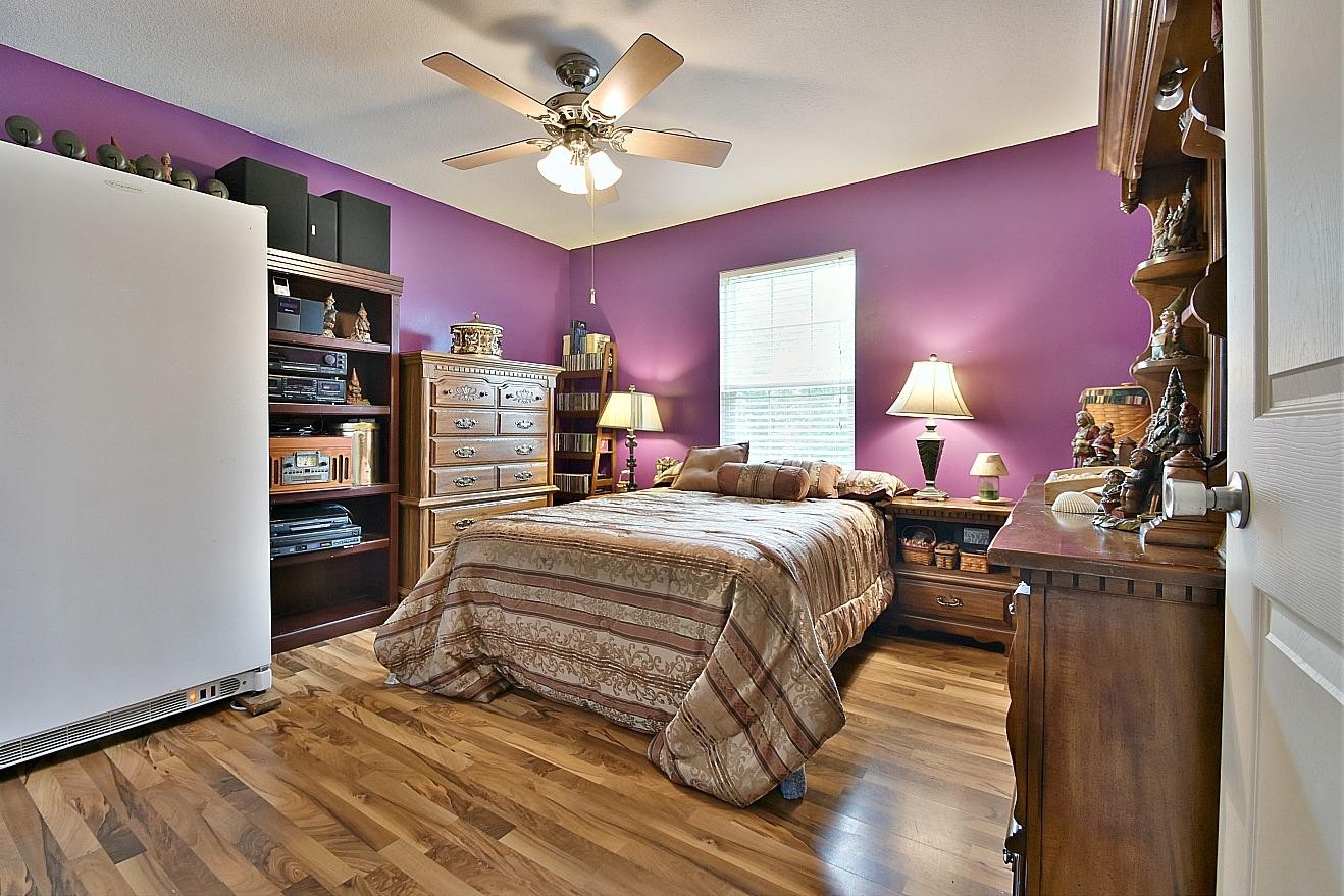 950 Chestnut Grove Road Dandridge, TN 37725 - Photo 17 of 25 a bedroom with a bed and a bookshelf
