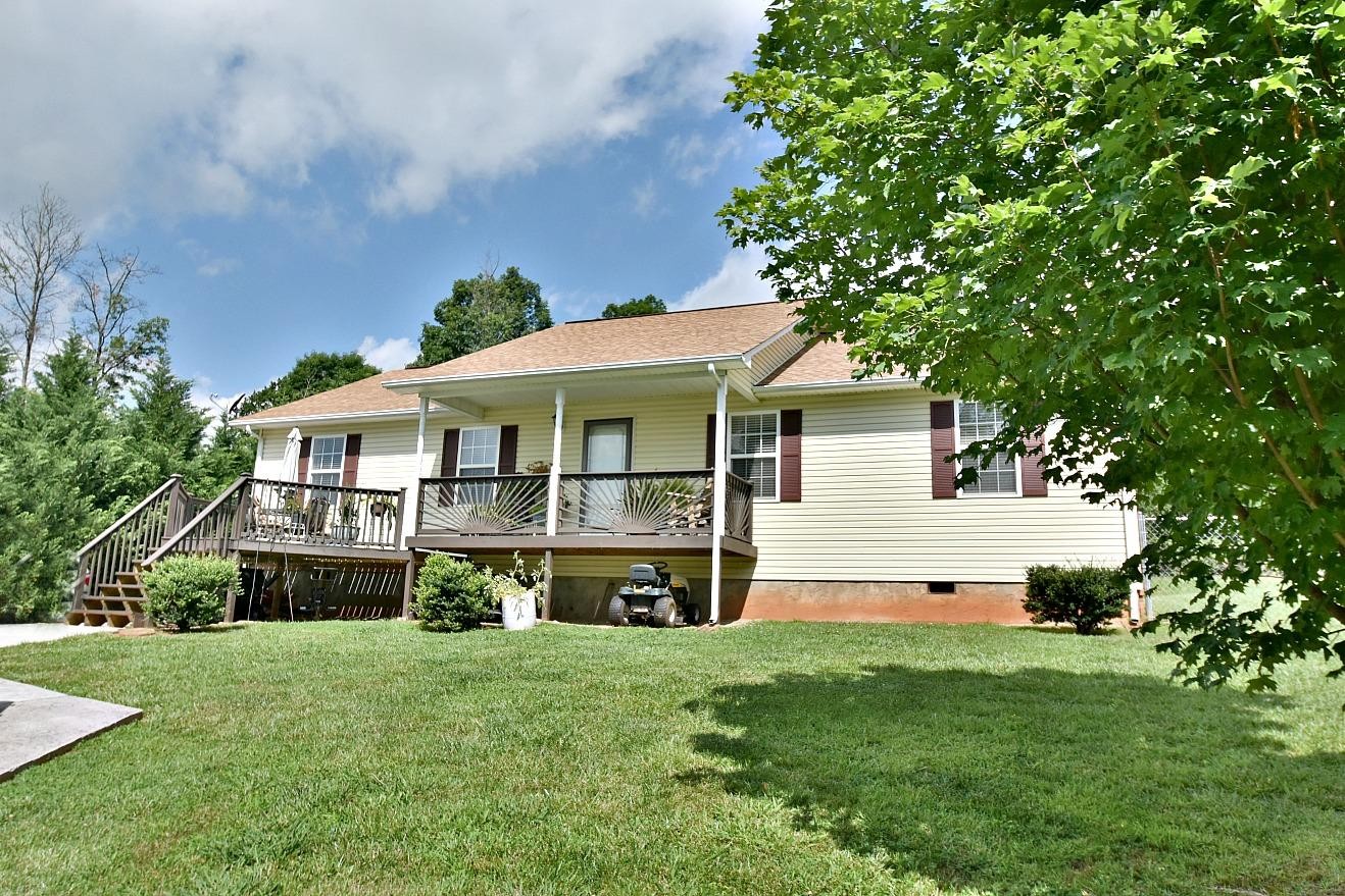950 Chestnut Grove Road Dandridge, TN 37725 - Photo 20 of 25 a front view of a house with a yard