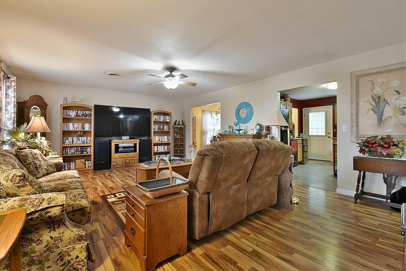 950 Chestnut Grove Road Dandridge, TN 37725 - Photo 2 of 25 a living room with furniture and a flat screen tv