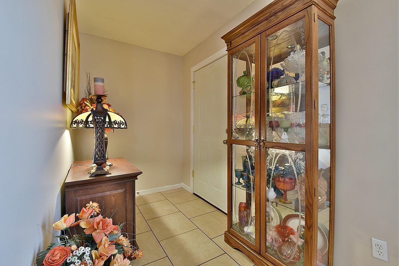 950 Chestnut Grove Road Dandridge, TN 37725 - Photo 3 of 25 a vase of flowers sitting in front of a door
