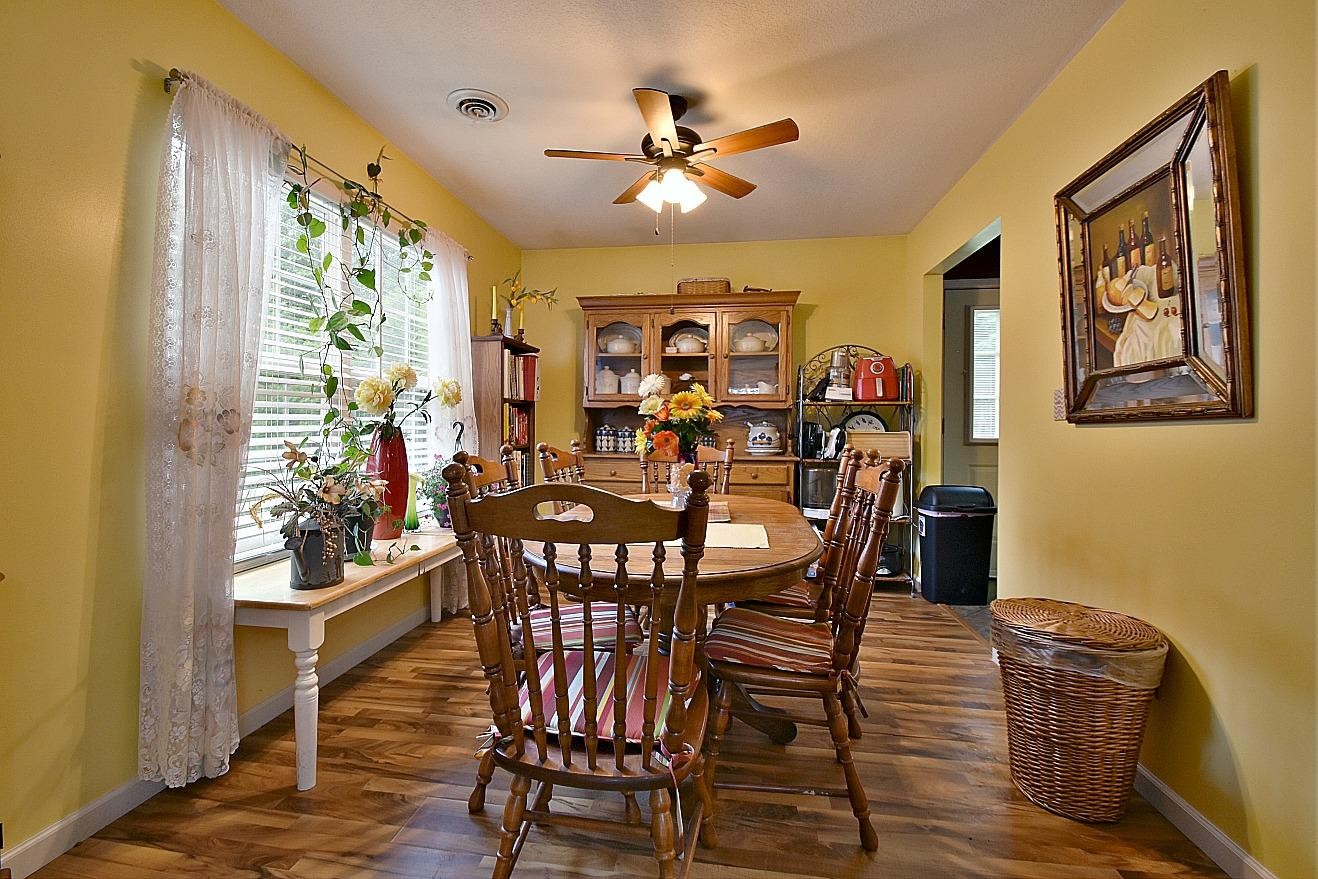 950 Chestnut Grove Road Dandridge, TN 37725 - Photo 7 of 25 a view of a dining room with furniture window and wooden floor