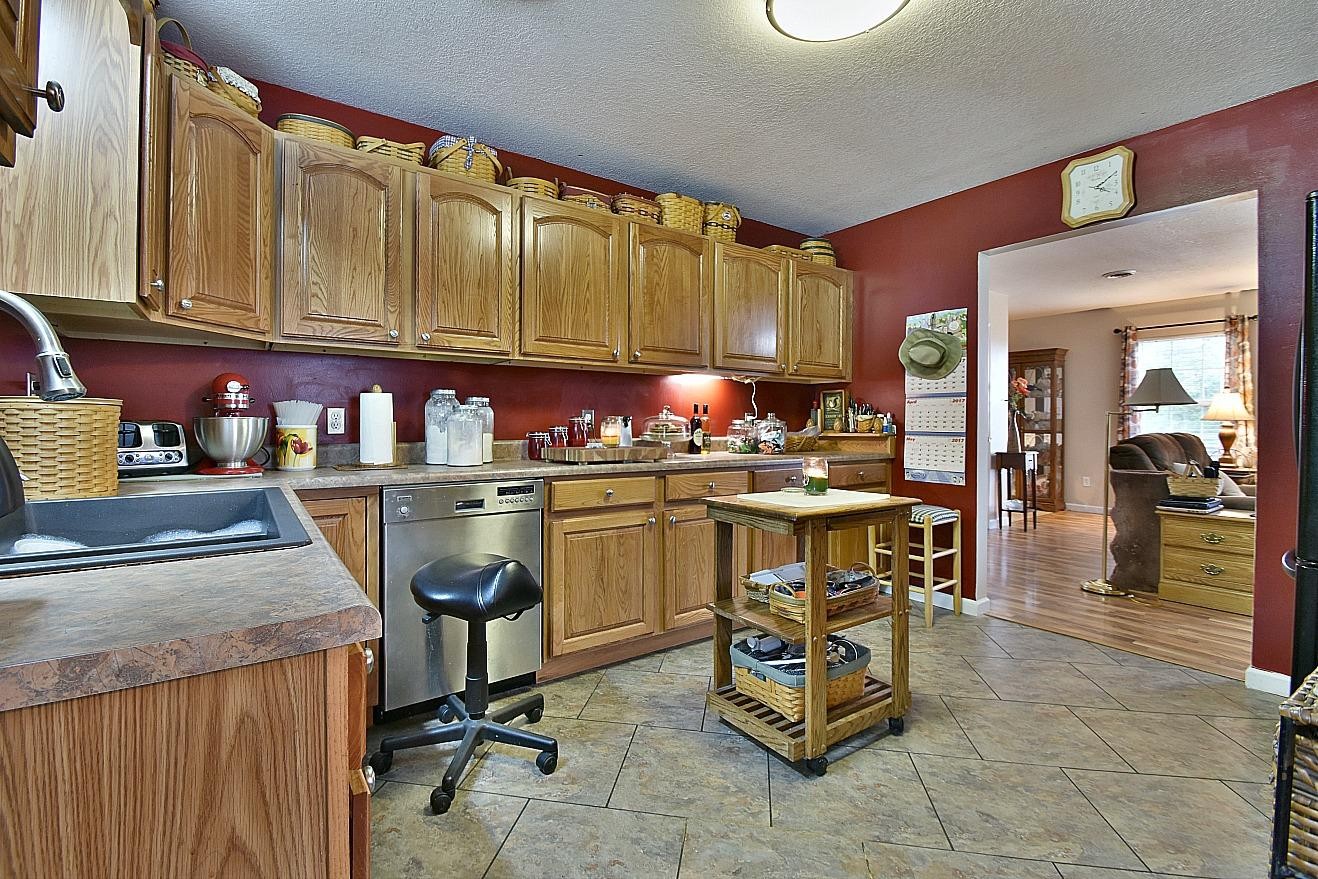 950 Chestnut Grove Road Dandridge, TN 37725 - Photo 9 of 25 a kitchen with a sink a counter and chairs