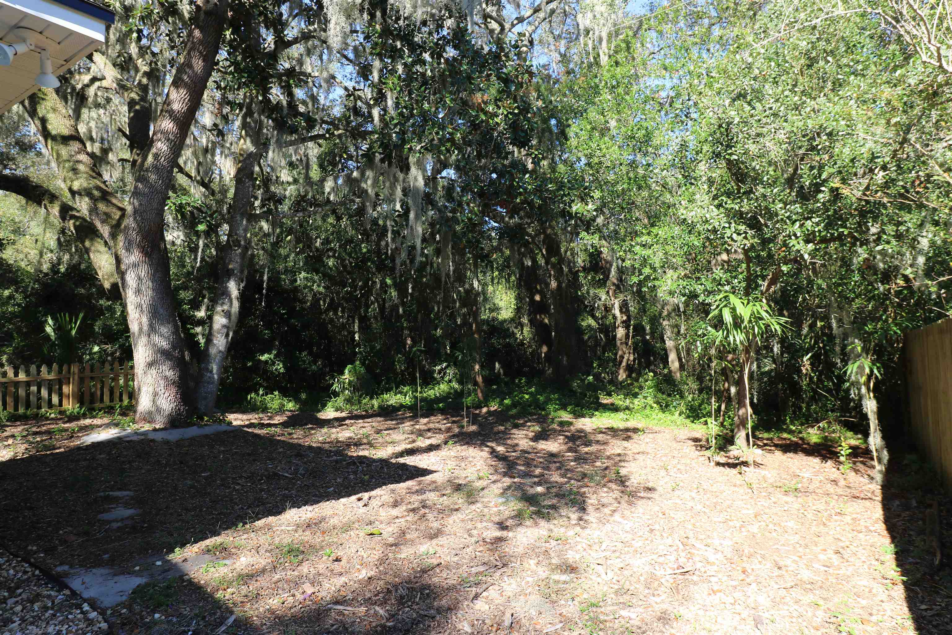 96 Barbarosa Street St. Augustine, FL 32086 - Photo 16 of 17 a view of outdoor space with trees