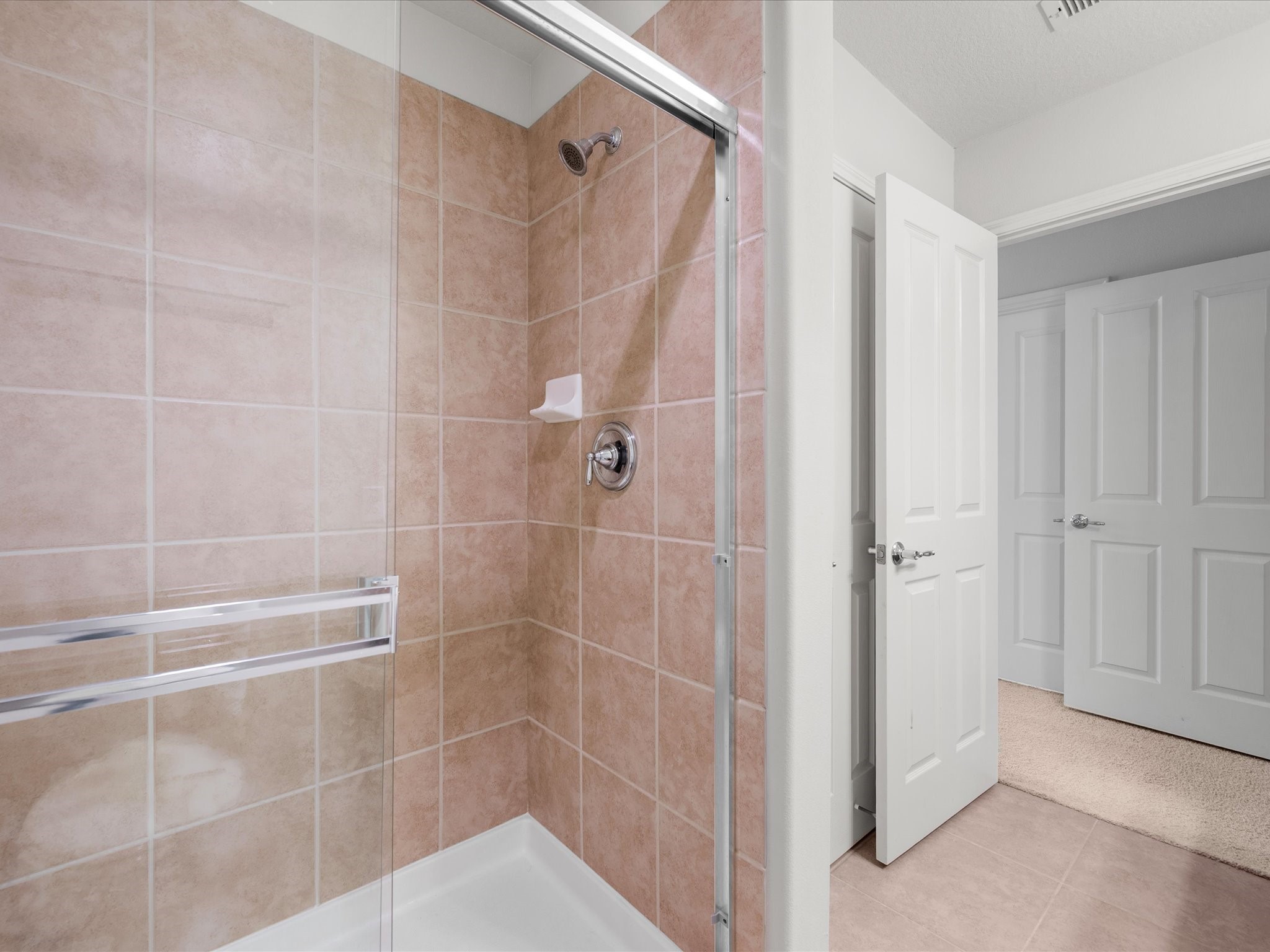 13600 Breton Ridge Street, Unit 31C Houston, TX 77070 - Photo 21 of 31 Start and end your day in the oversized walk-in shower, offering a clean, functional space within the primary bath.