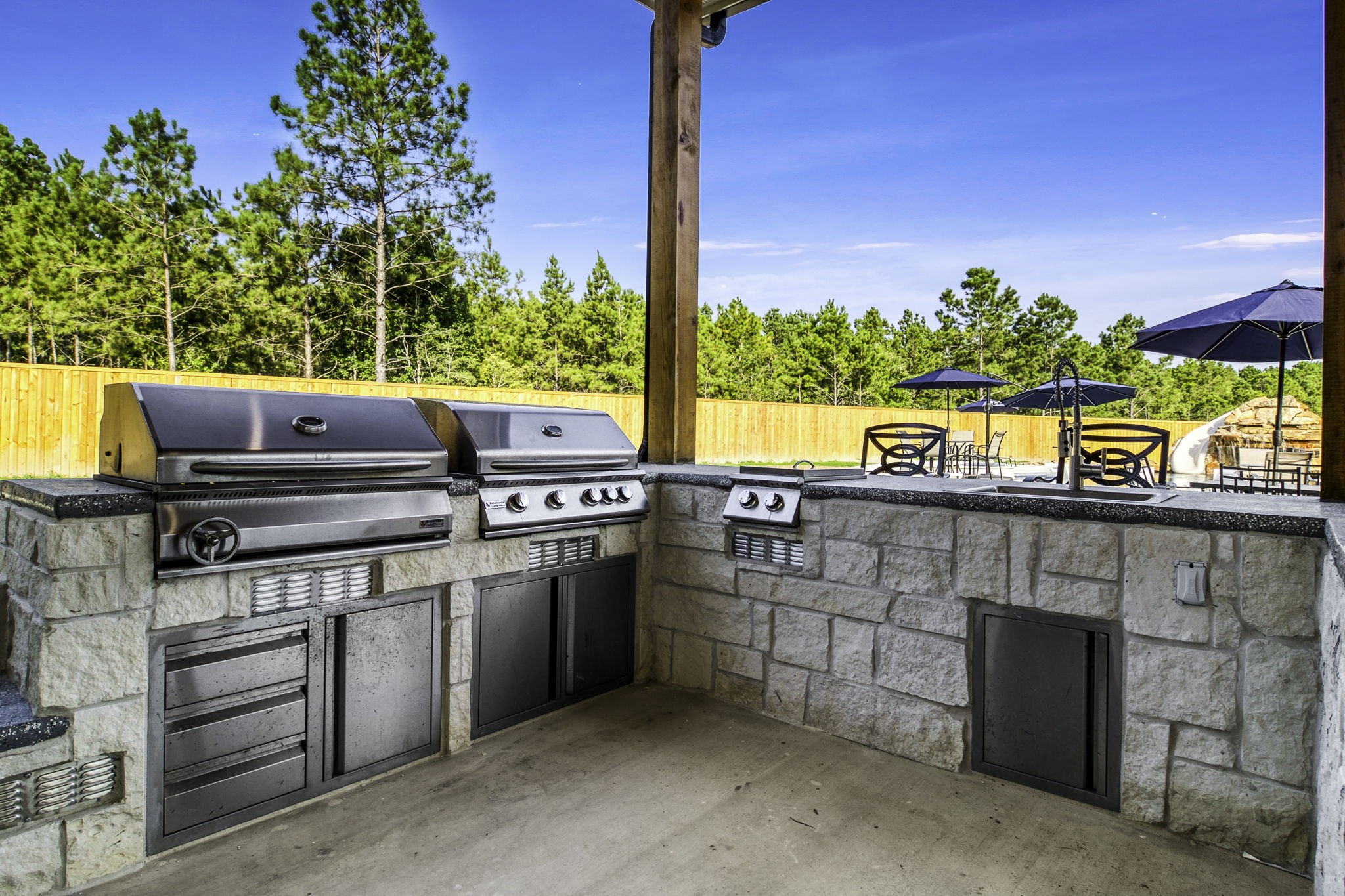 4602 Fm 3459 Road Onalaska, TX 77360 - Photo 37 of 45 a kitchen with stainless steel appliances a stove and a refrigerator
