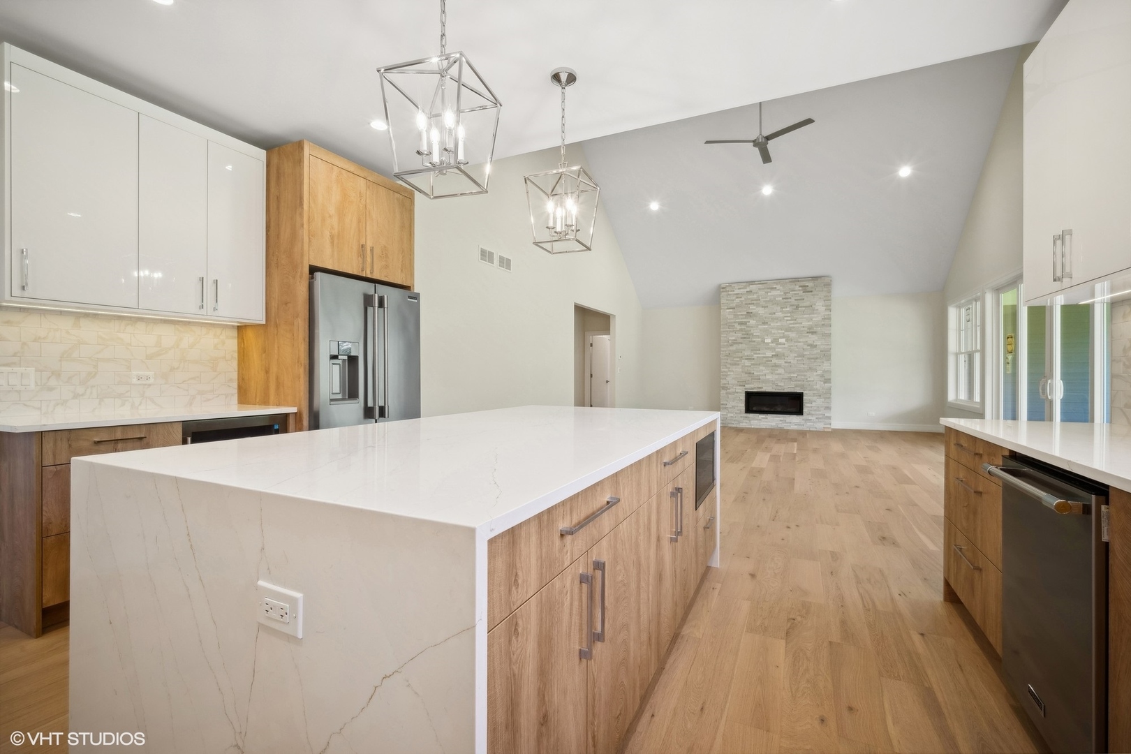 1223 Noble Drive Des Plaines, IL 60018 - Photo 12 of 52 a large kitchen with stainless steel appliances a large counter top a sink a refrigerator and a window