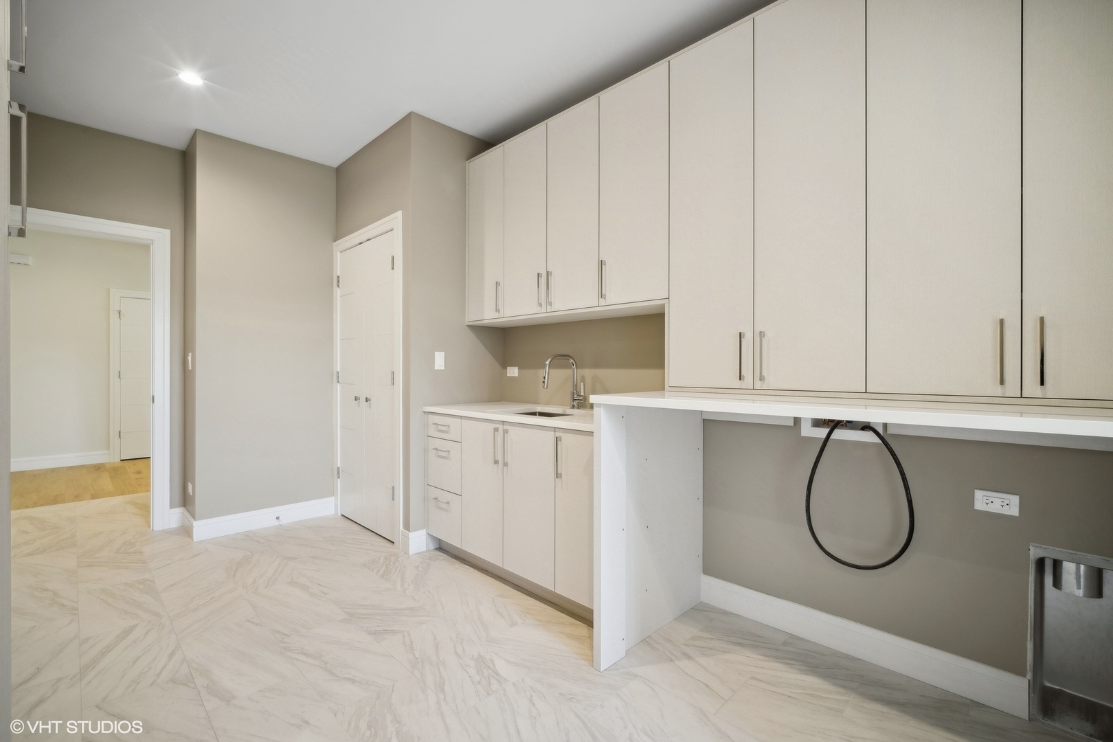 1223 Noble Drive Des Plaines, IL 60018 - Photo 24 of 52 a kitchen with white cabinets and a window