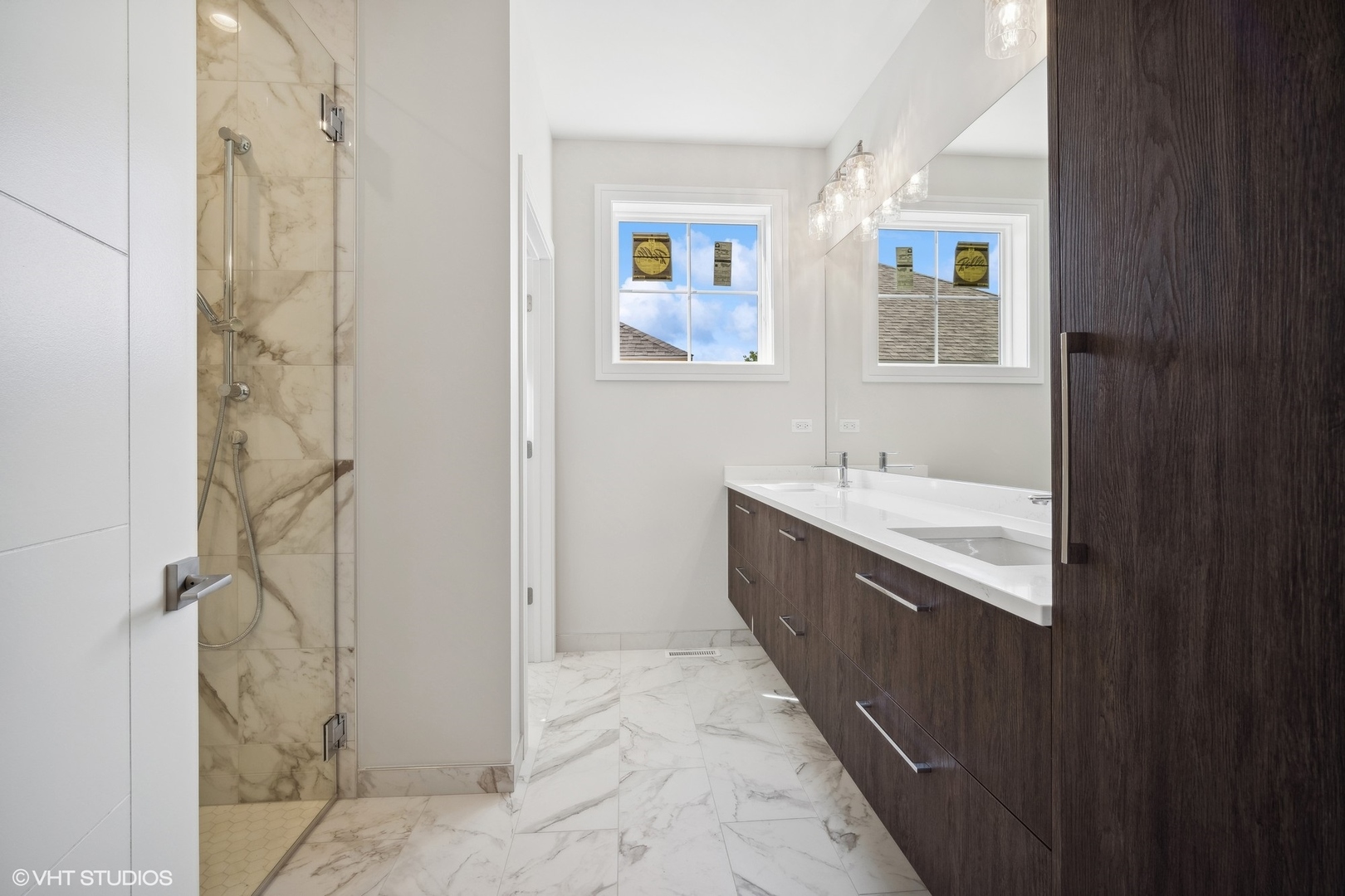 1223 Noble Drive Des Plaines, IL 60018 - Photo 28 of 52 a bathroom with a double vanity sink a mirror and a shower