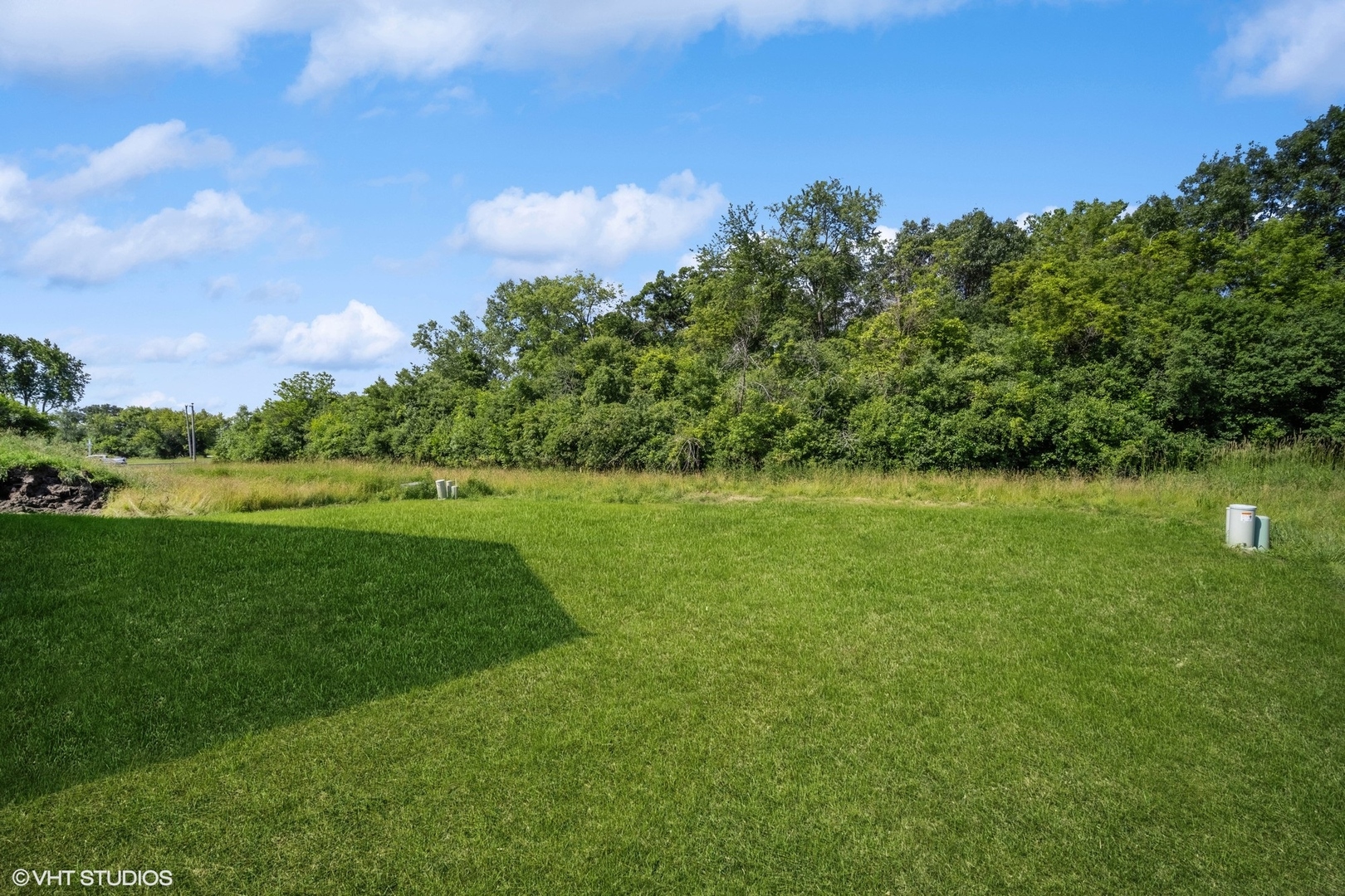 1223 Noble Drive Des Plaines, IL 60018 - Photo 45 of 52 a view of a green field with wooden fence