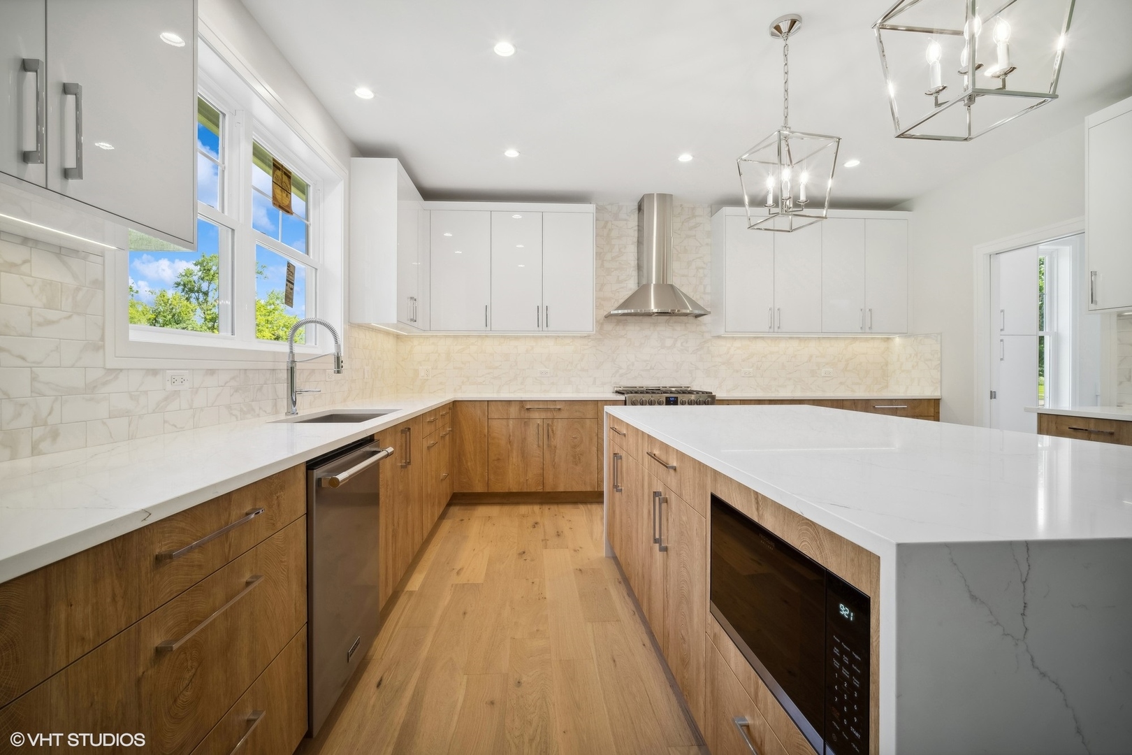 1223 Noble Drive Des Plaines, IL 60018 - Photo 7 of 52 a large kitchen with stainless steel appliances granite countertop a sink a stove and a wooden floors