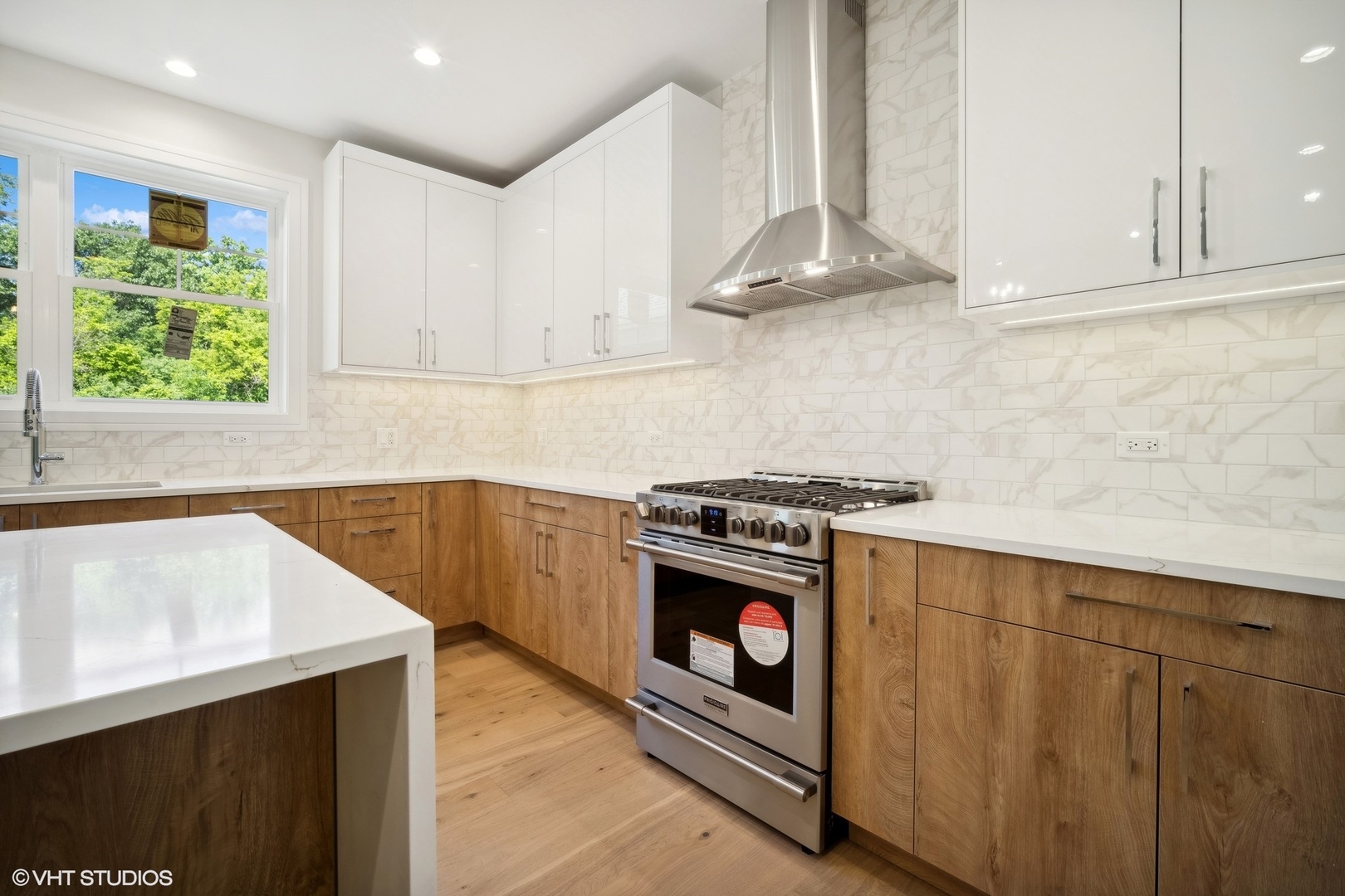1223 Noble Drive Des Plaines, IL 60018 - Photo 10 of 52 a kitchen with stainless steel appliances granite countertop a stove a sink and a microwave
