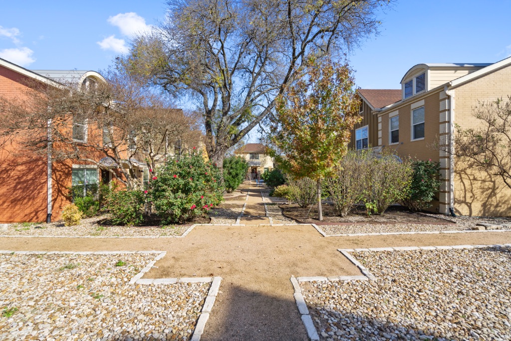 1101 Grove Boulevard, Unit 206 Austin, TX 78741 - Photo 17 of 23 a view of a house with a yard and covered with snow