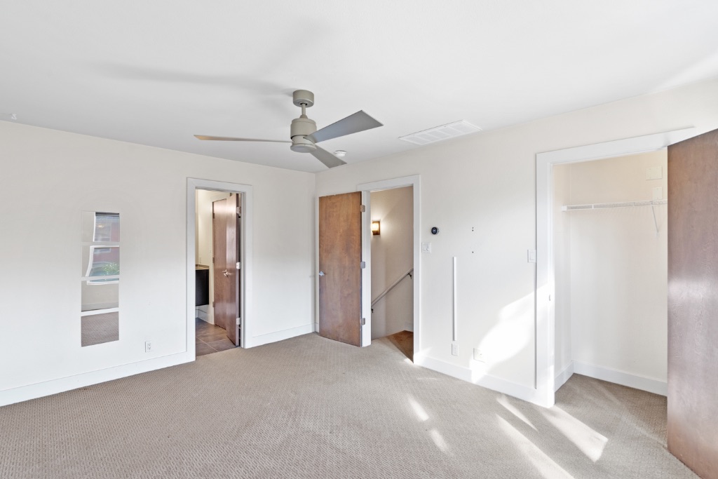 1101 Grove Boulevard, Unit 206 Austin, TX 78741 - Photo 3 of 23 a view of a livingroom with a ceiling fan window and entryway