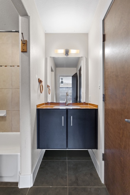 1101 Grove Boulevard, Unit 206 Austin, TX 78741 - Photo 5 of 23 a bathroom with a sink and a mirror