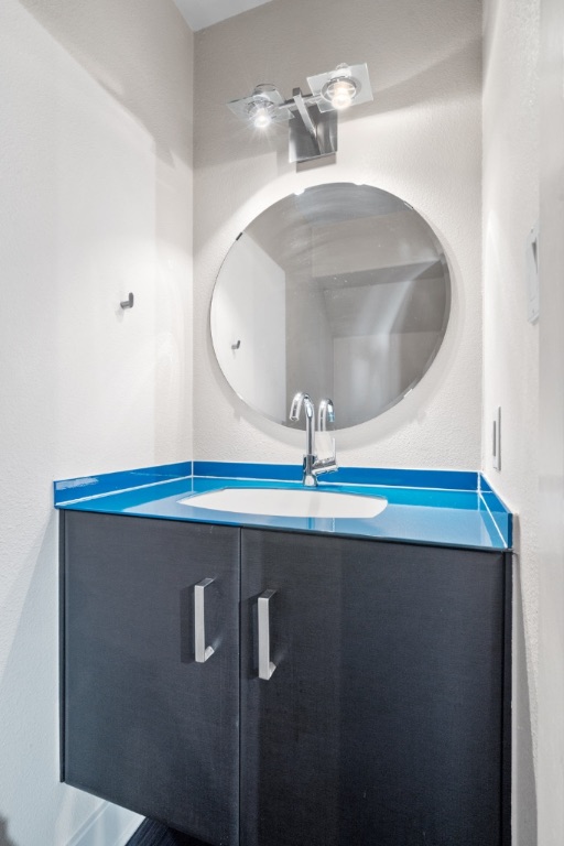 1101 Grove Boulevard, Unit 206 Austin, TX 78741 - Photo 6 of 23 a bathroom with a sink and mirror