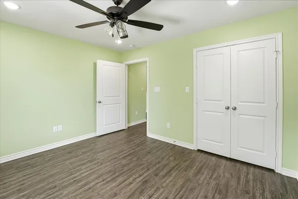 a bathroom with a granite countertop sink mirror and shower