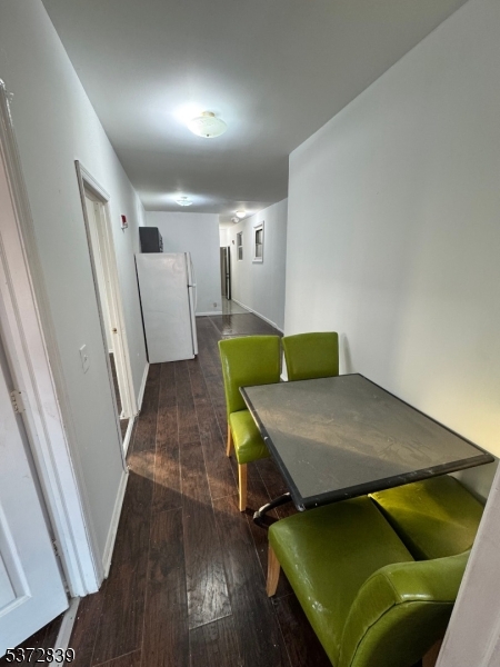 a room with wooden floor and furniture