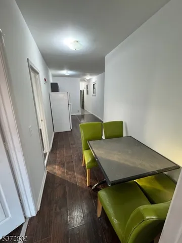 a room with wooden floor and furniture